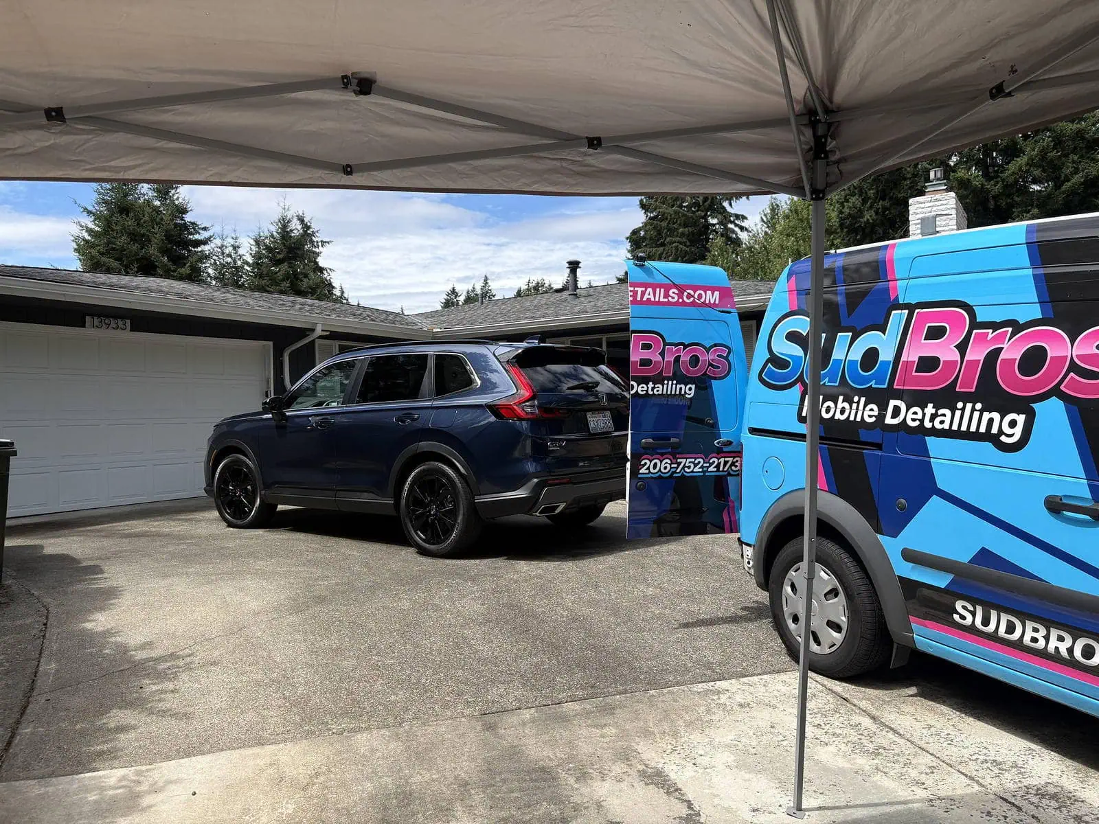 SudBros mobile detailing van set up for a ceramic coating install in a Seattle driveway